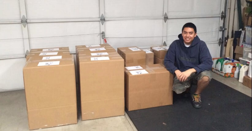 tim sanders in his parents garage getting his first Amazon shipping ready to go