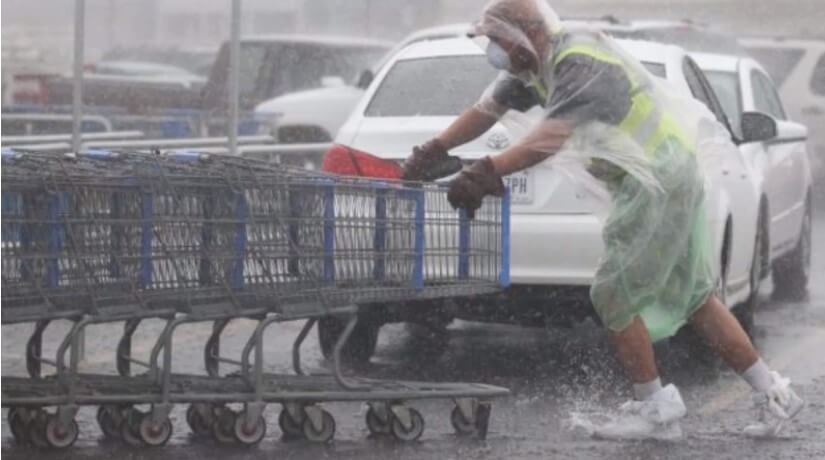 tim sanders gathering shopping carts in the rain